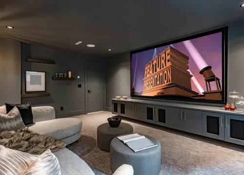 A stylish media wall with integrated shelving and lighting, enhancing the living room's functionality and design.